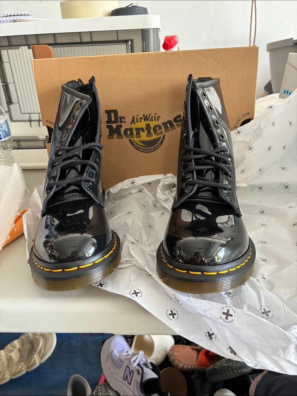 New in Box Dr. Martens Black Patent 8-Eye Lace-Up Combat Boots w/yellow stitch.